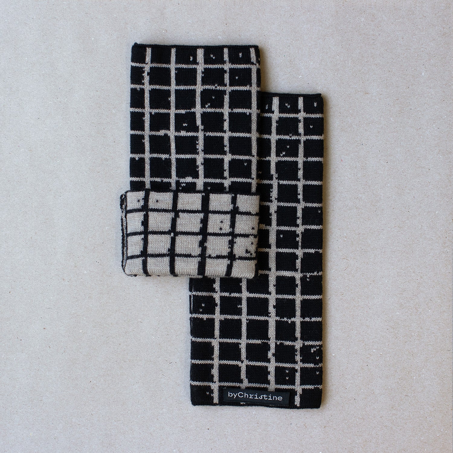 KARO Pulswärmer, schwarz–beige